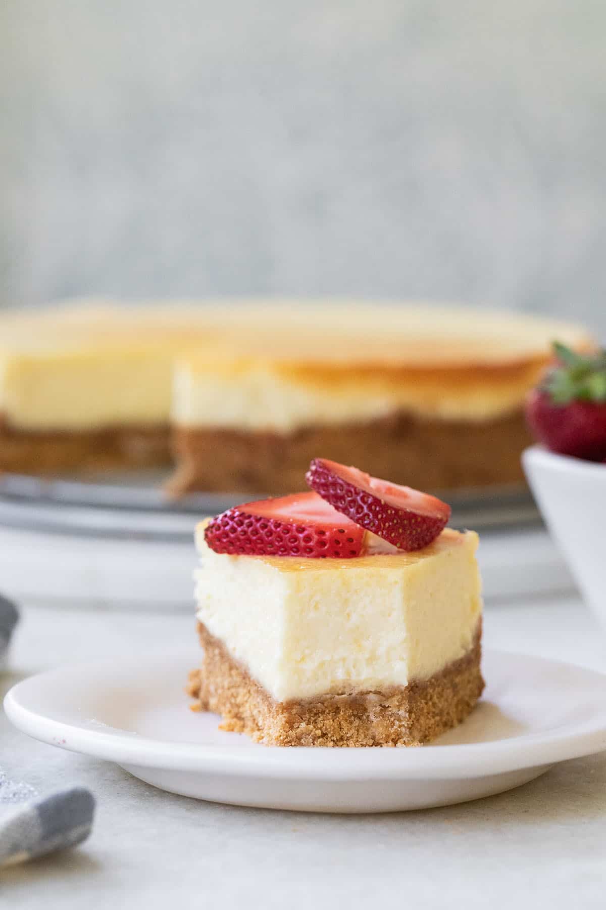 Simple cheesecake recipe with a bite taken out.