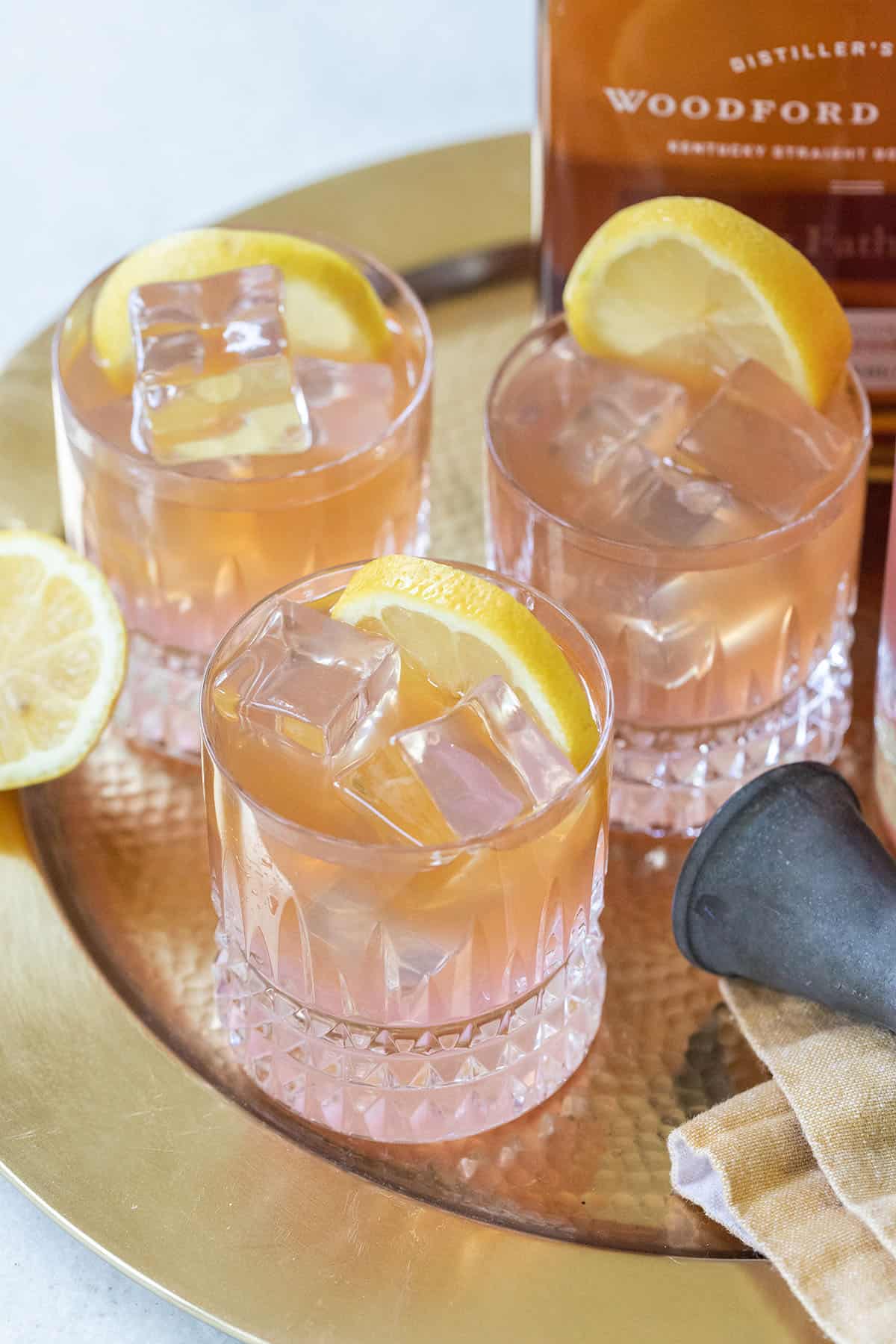 Cocktail with lemon in short glass with ice.