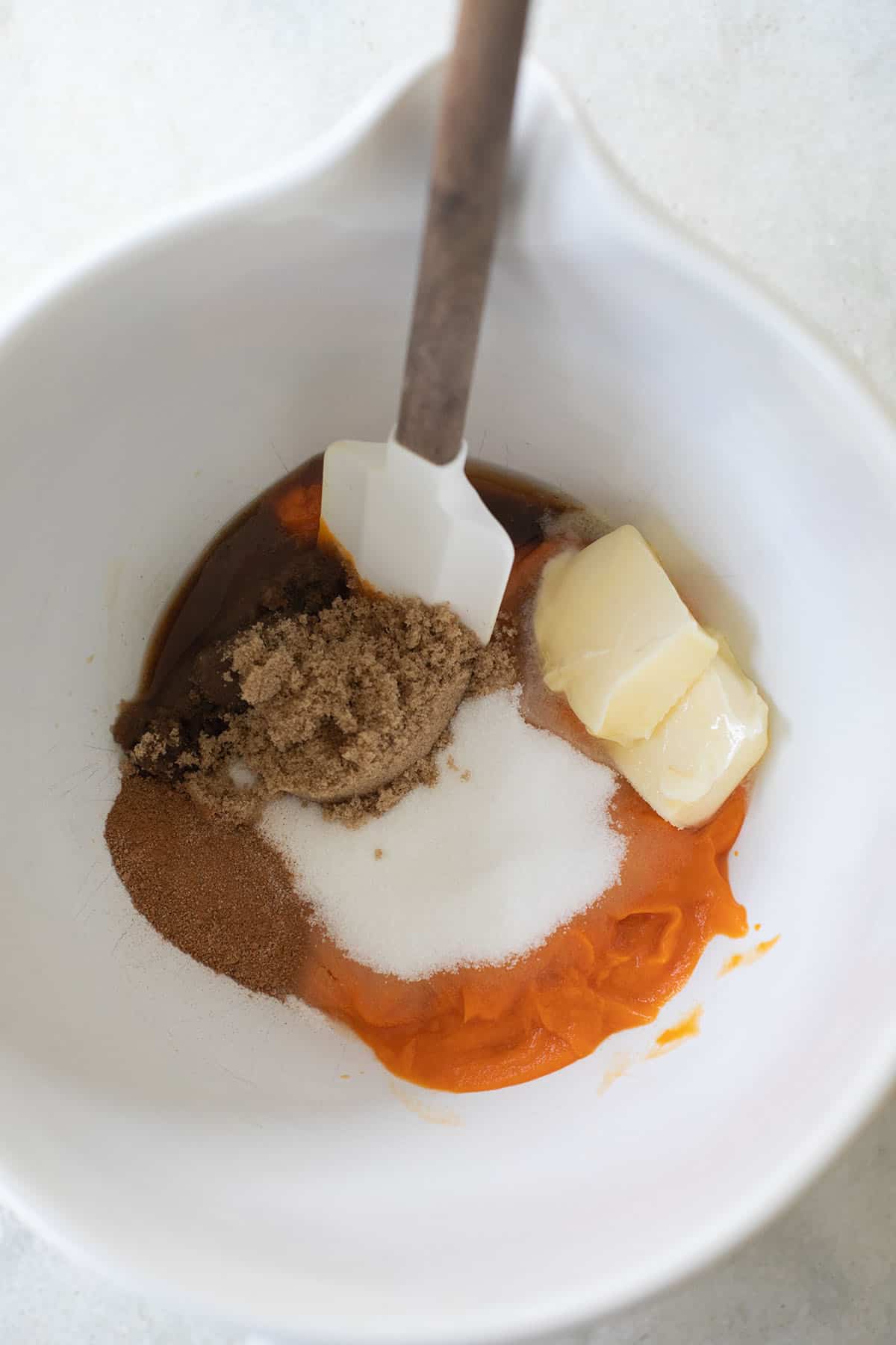 sugar, butter, sweet potatoes in a mixing bowl