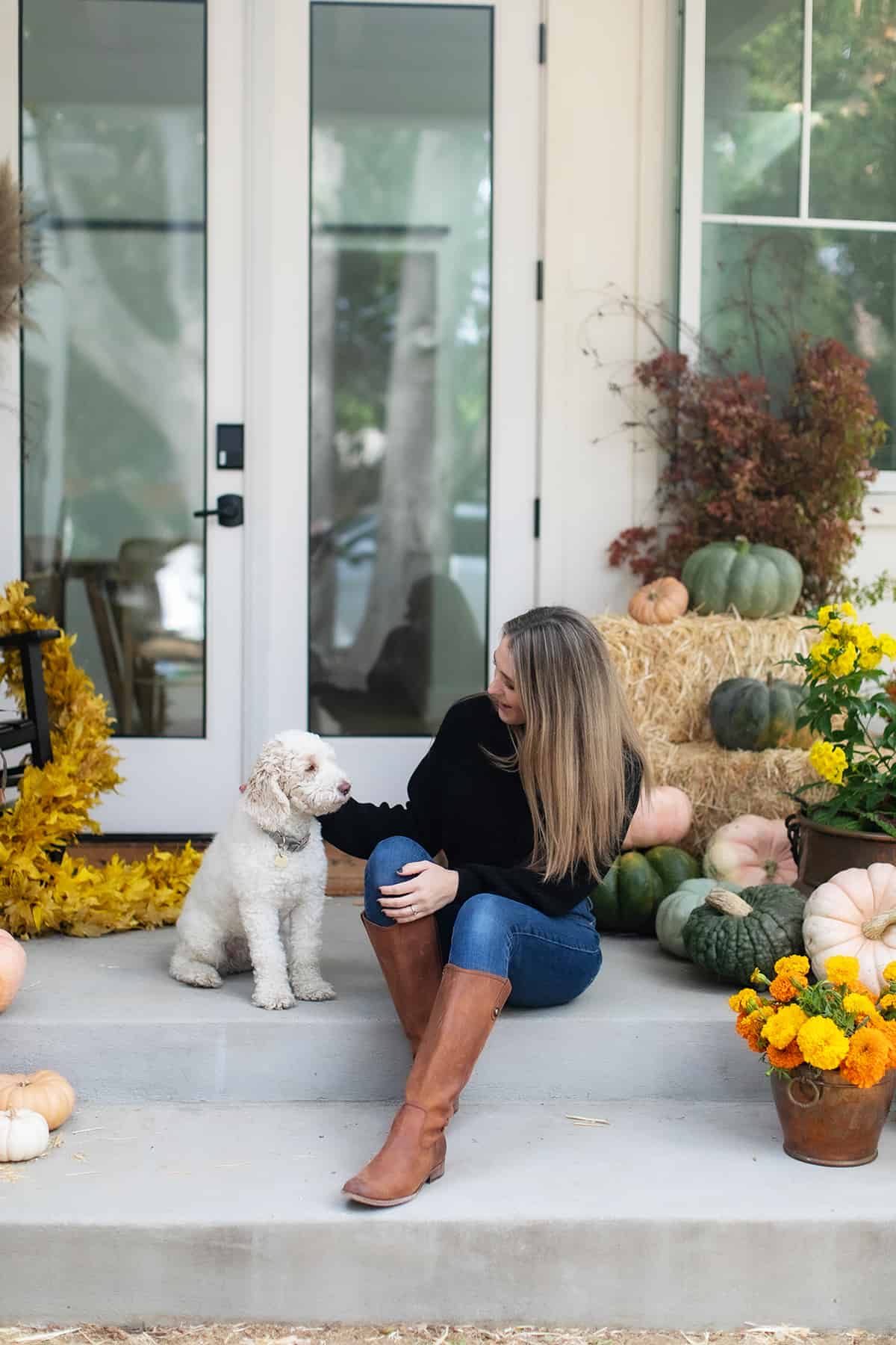 Eden Passante on her front porch with her dog.