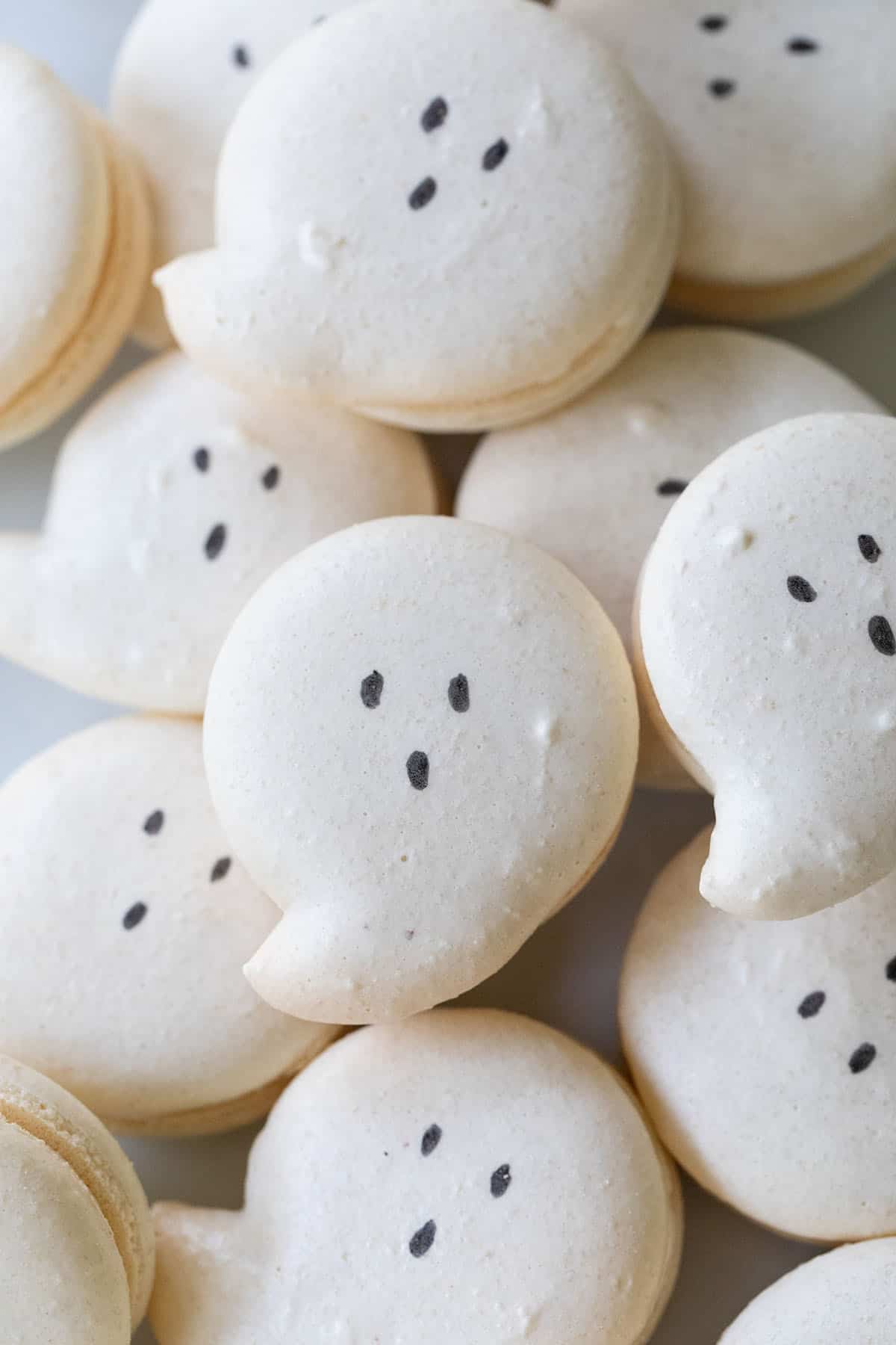 Ghost macarons with eyes.