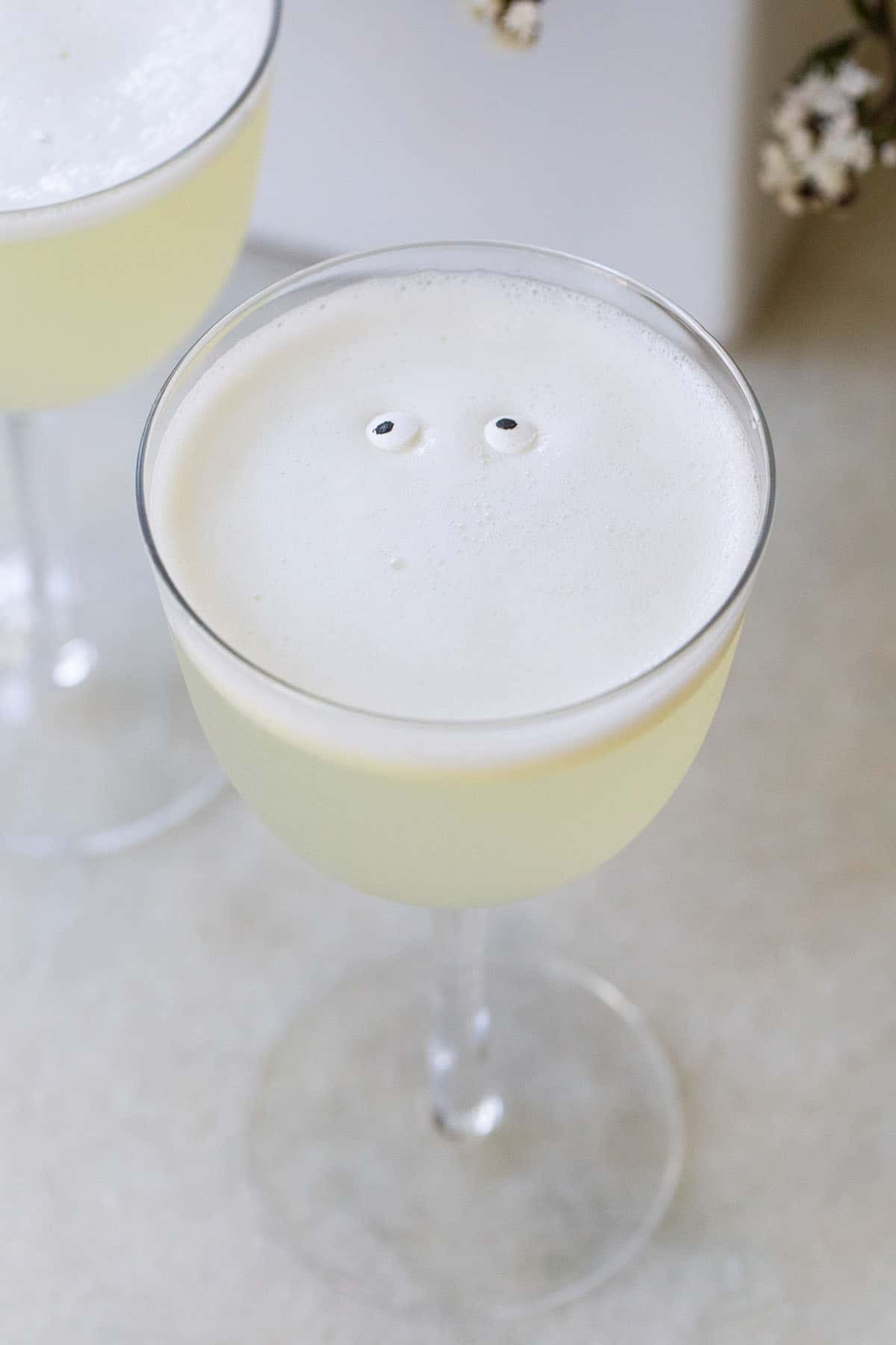 White lady cocktail with eye sprinkles.