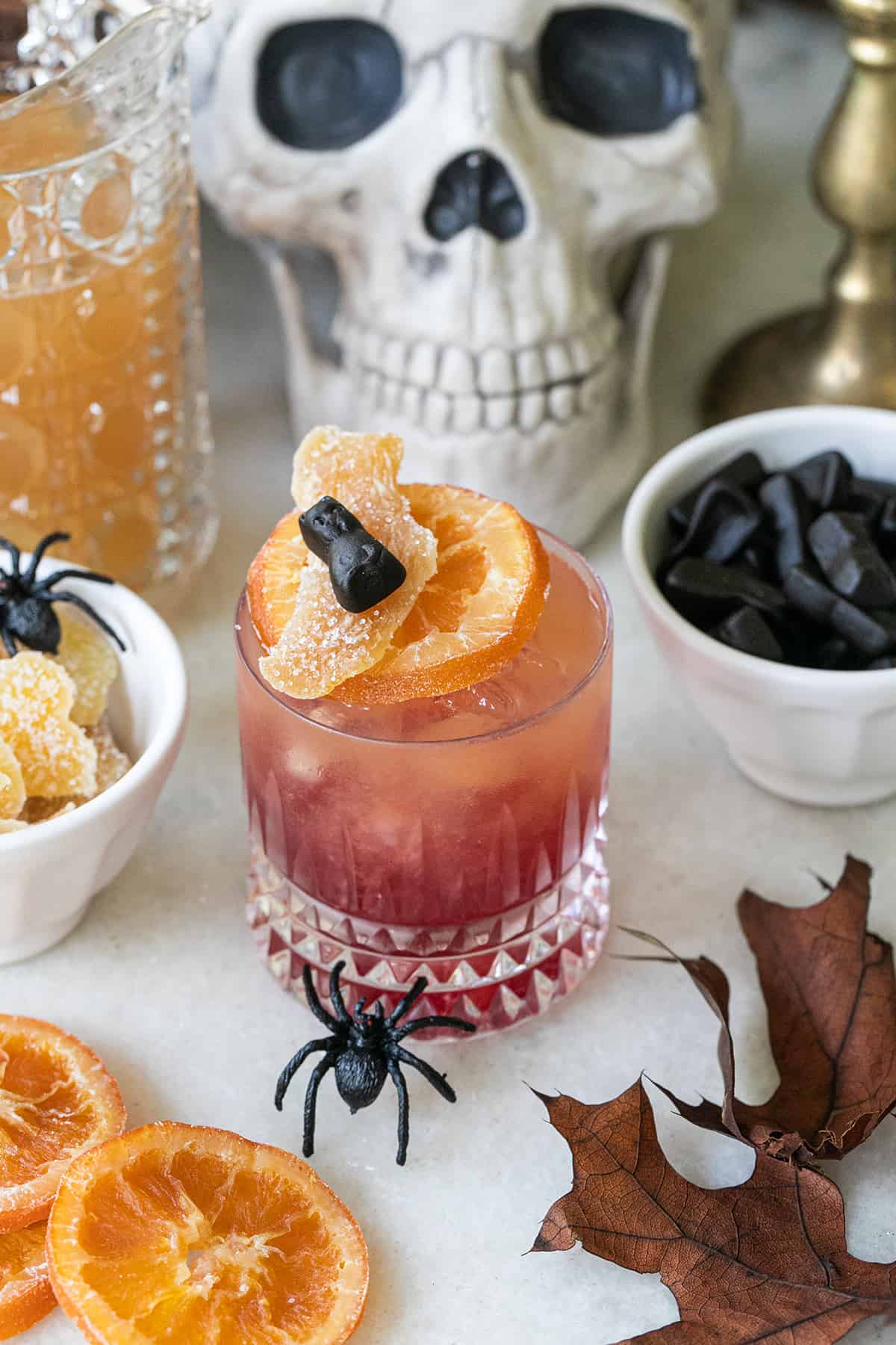 an orange cocktail with garnish - punch bowl, halloween recipes, lime sherbet, dry ice, vanilla vodka, whipped vodka
