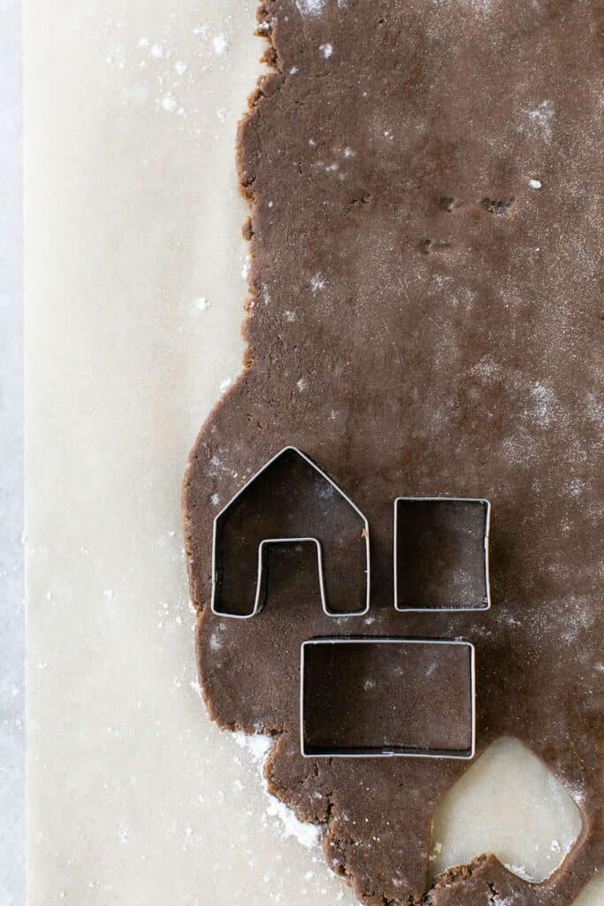 Mini gingerbread house template in gingerbread dough.