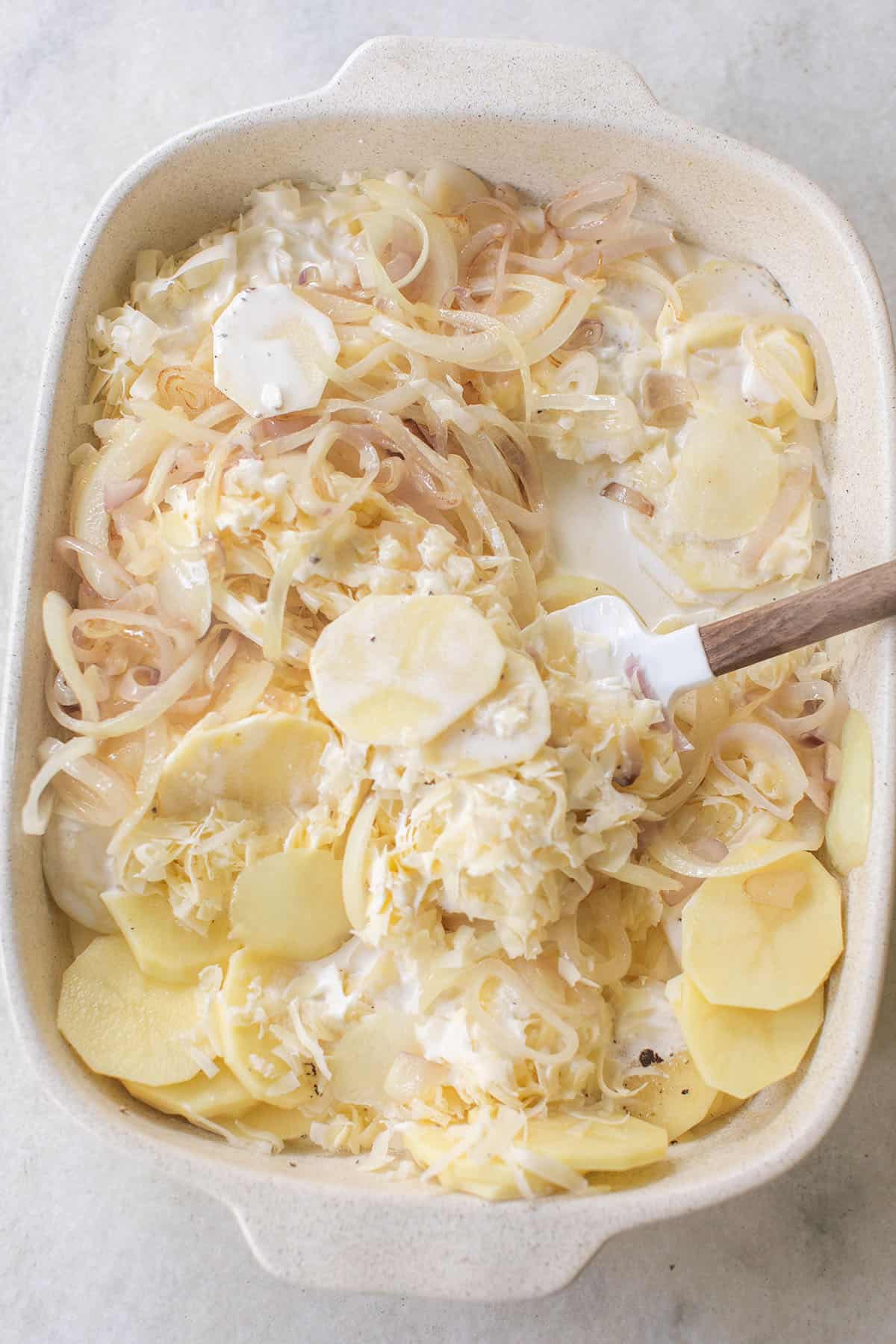 Cheese scalloped potato recipe with cream baked until golden brown.