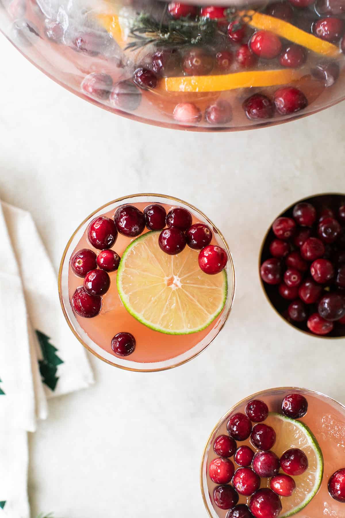 holiday cocktail with lime and cranberries