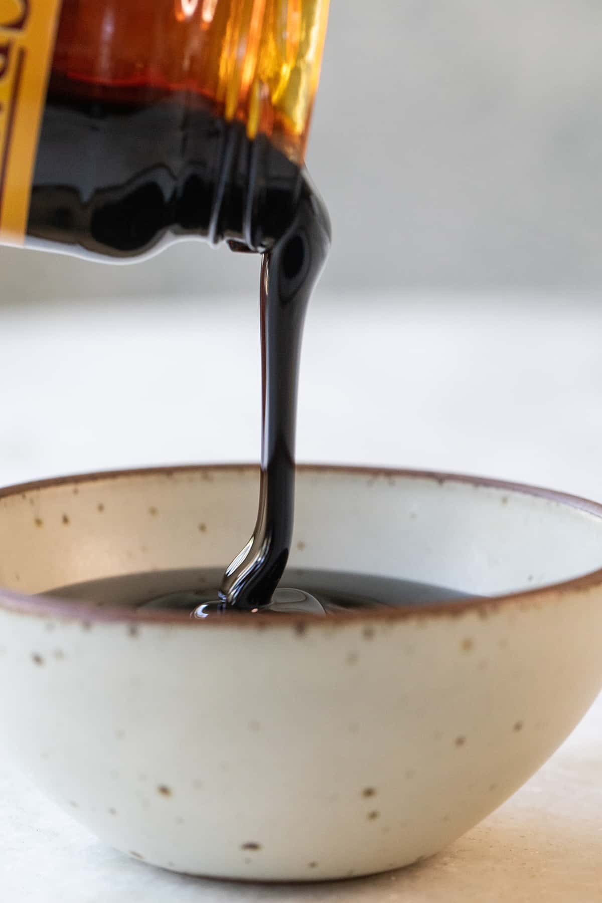 molasses being poured into a bowl