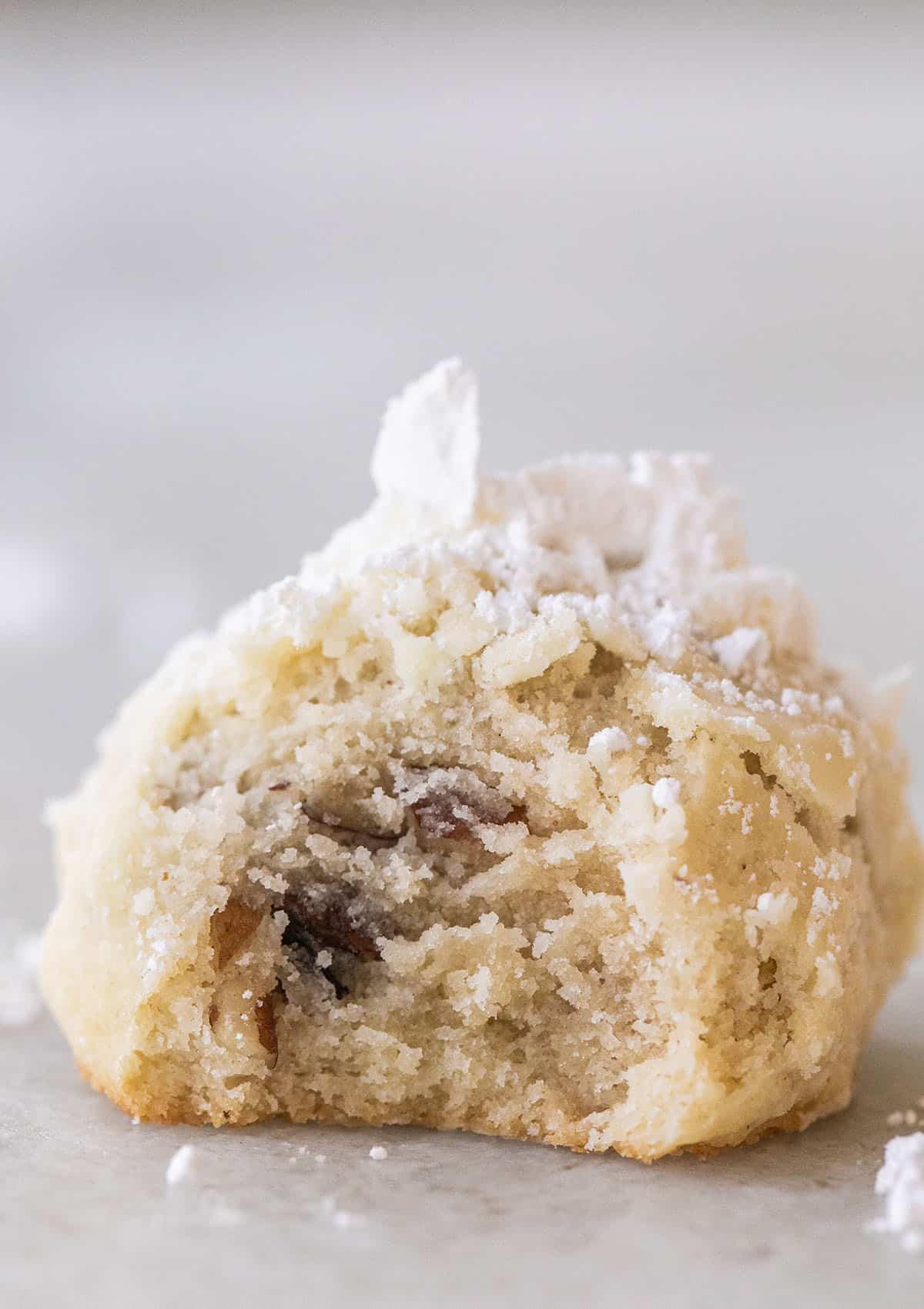 pecan snowball cookie with bite taken out