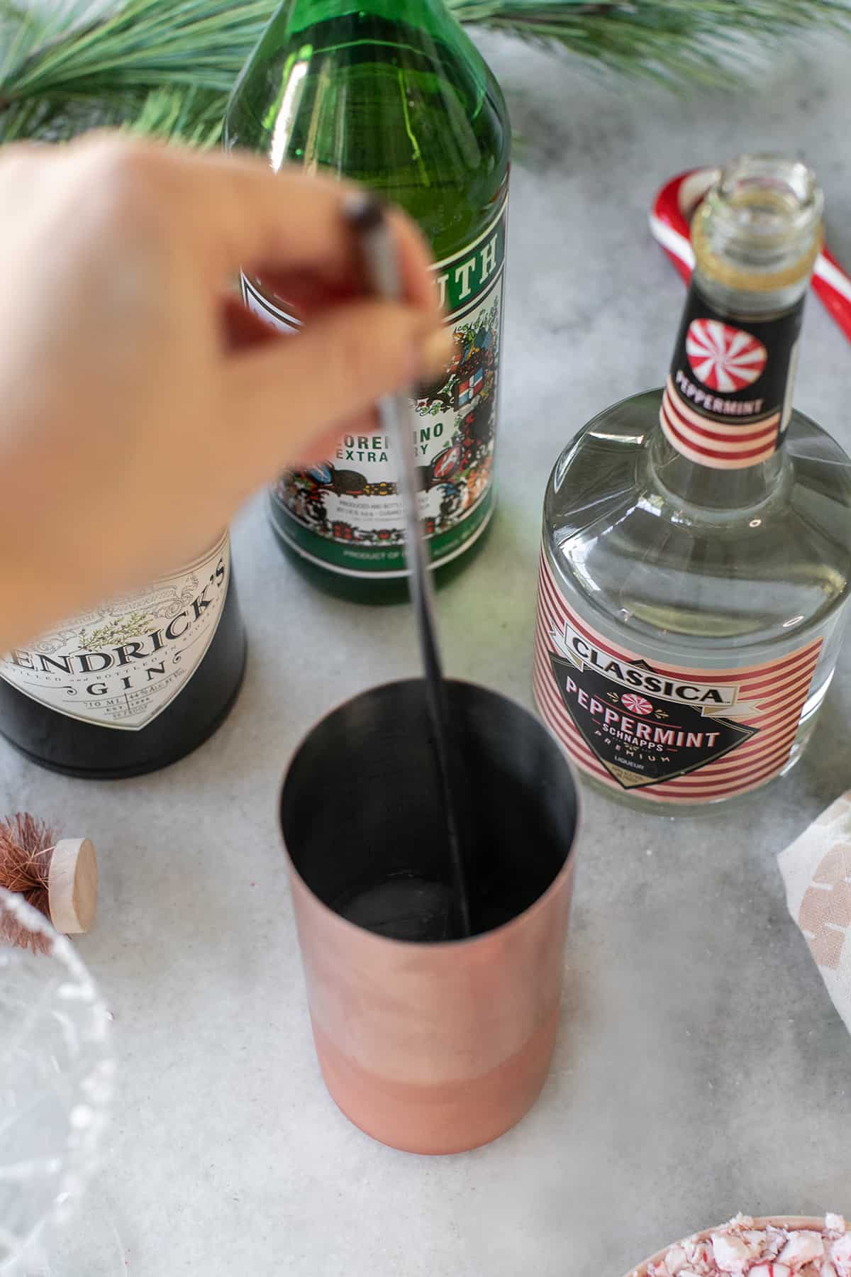 stirring a martini - vanilla vodka, chocolate syrup, melted chocolate.