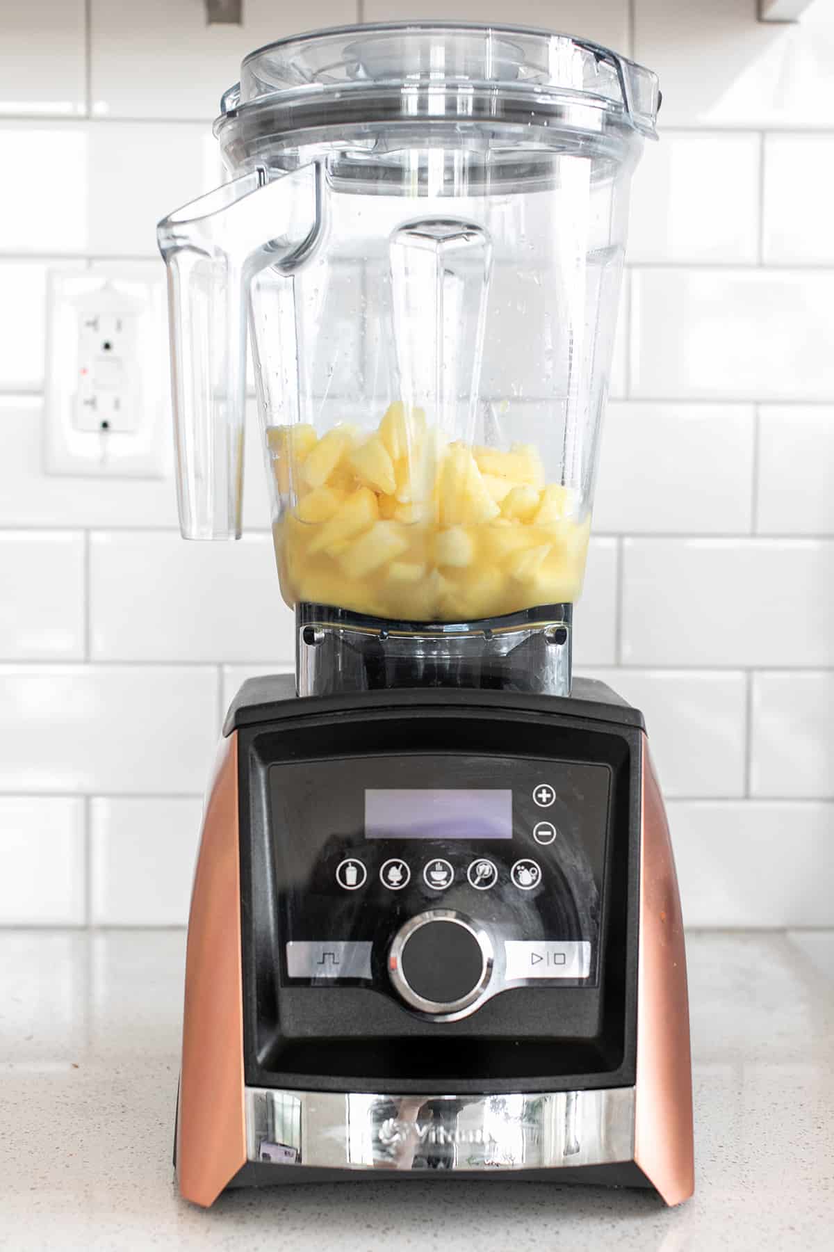 frozen pineaple and coconut in a blender
