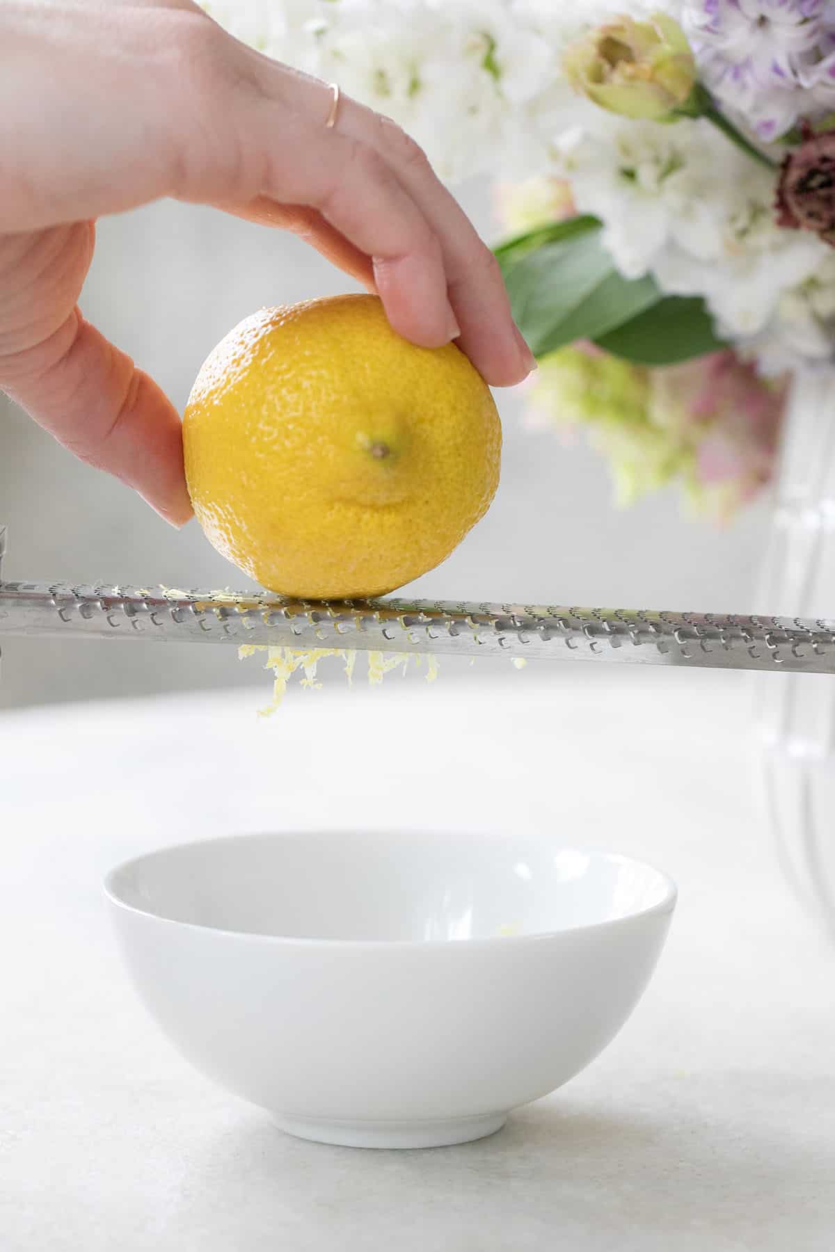 zesting a lemon with a microplane