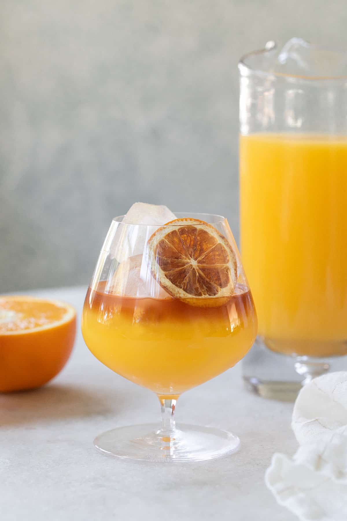 coconut rum and orange juice drink with a flower
