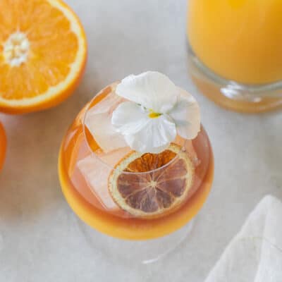 rum and orange juice drink with a flower