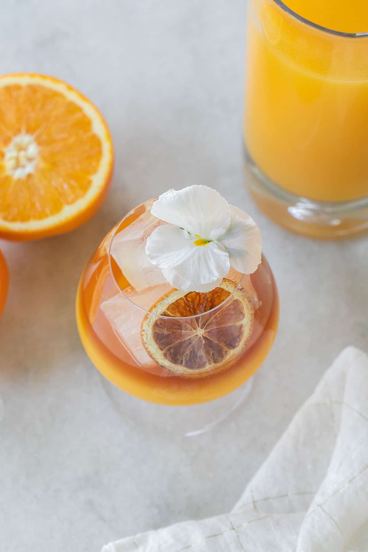 rum and orange juice drink with a flower