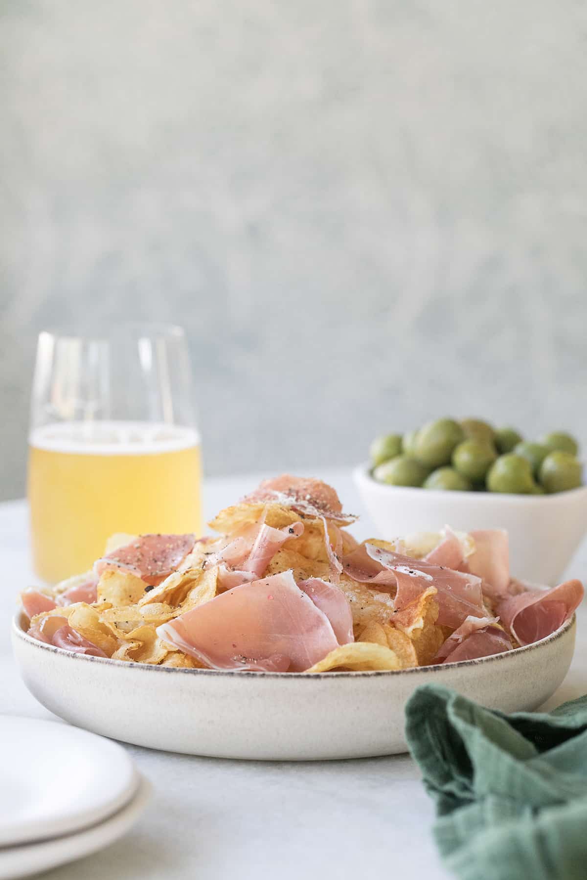 appetizer with chips and prosciutto - potato chips, black truffle potato chips, authentic black summer truffles, actual product packaging, thin slices