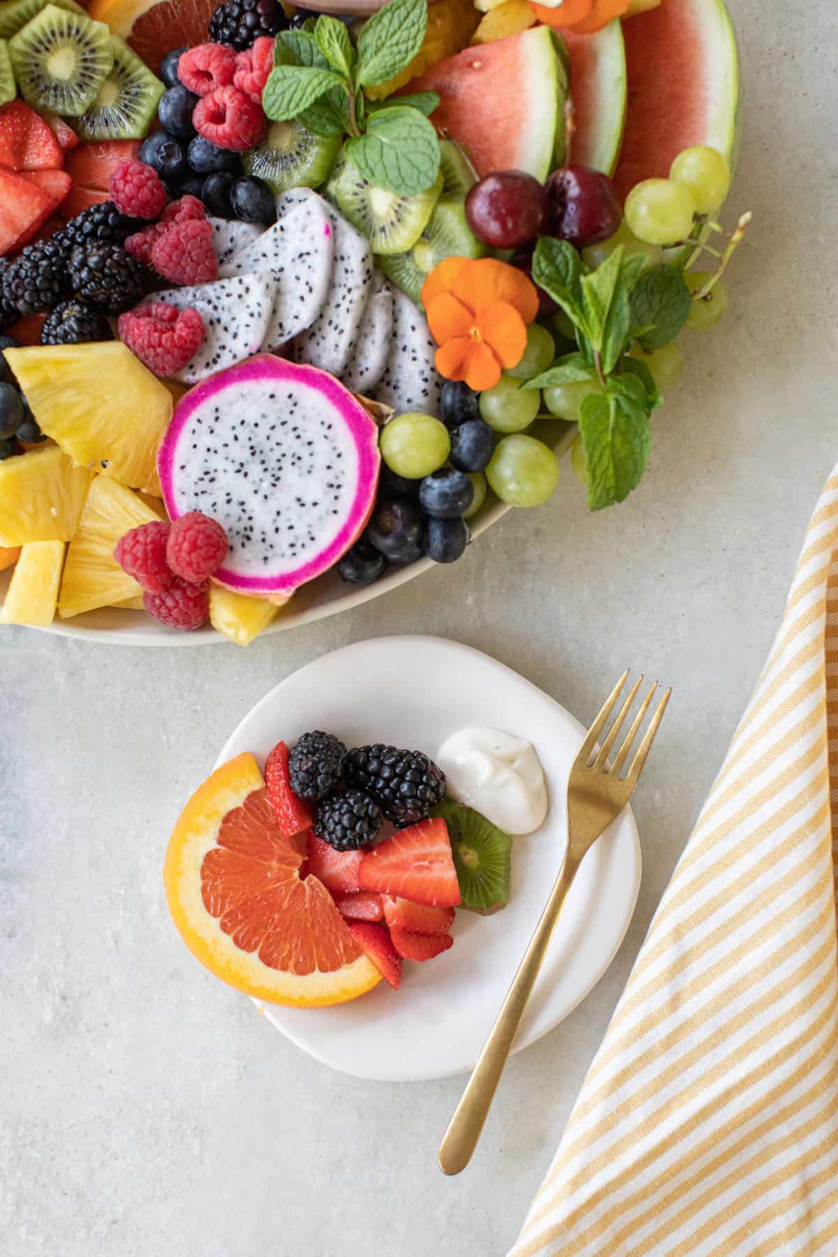 fresh fruit on a small plate with fruit dip