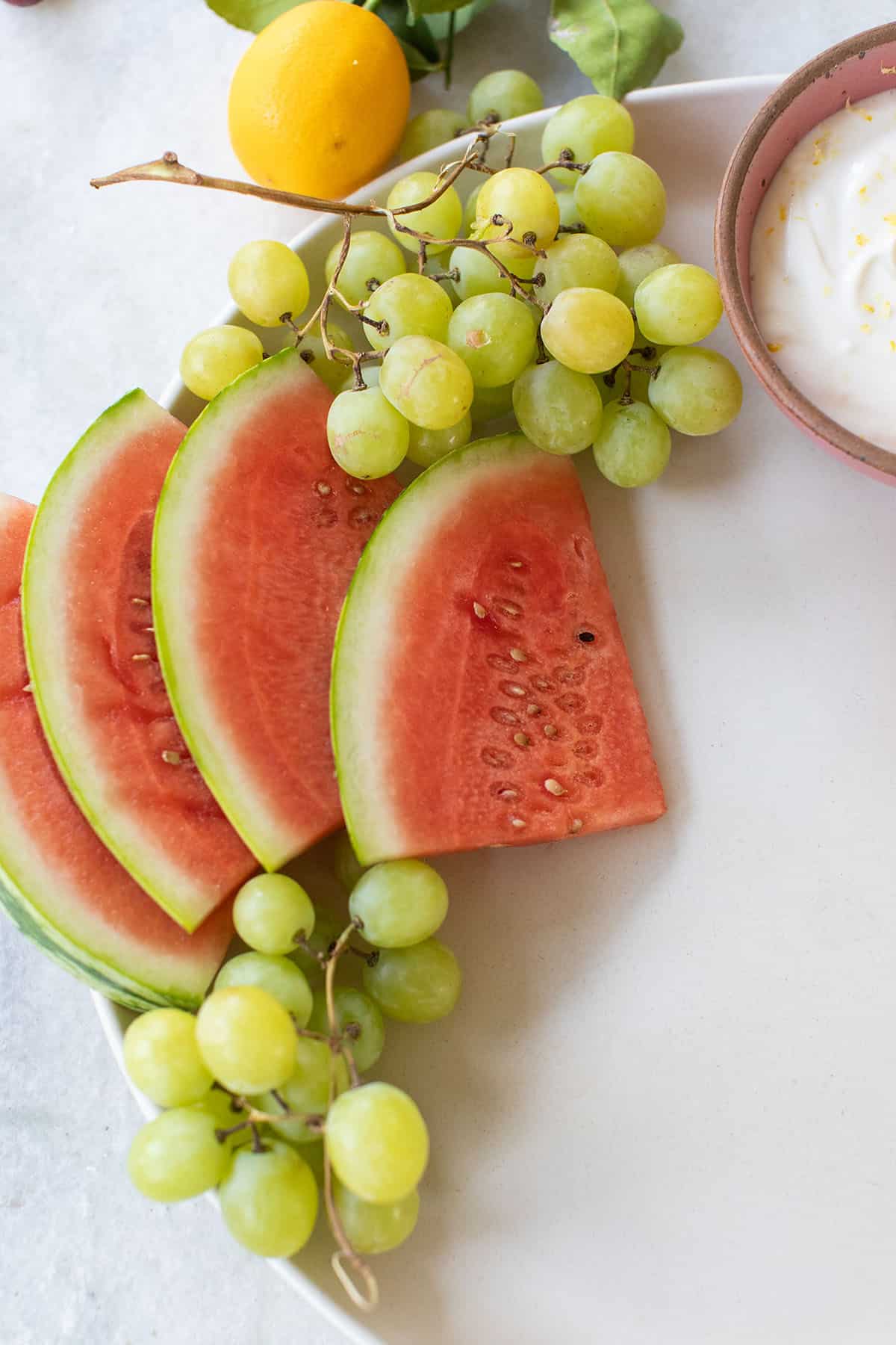 watermelon and grapes on a platter.