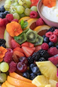 kiwi and berries layered on a fruit platter