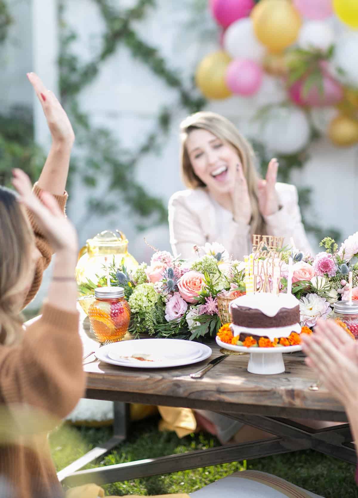 adults playing sitting around a table