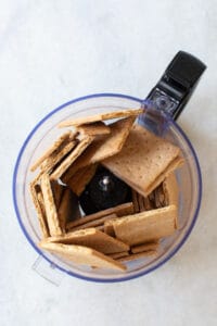 Pulsing graham crackers to make a crust.