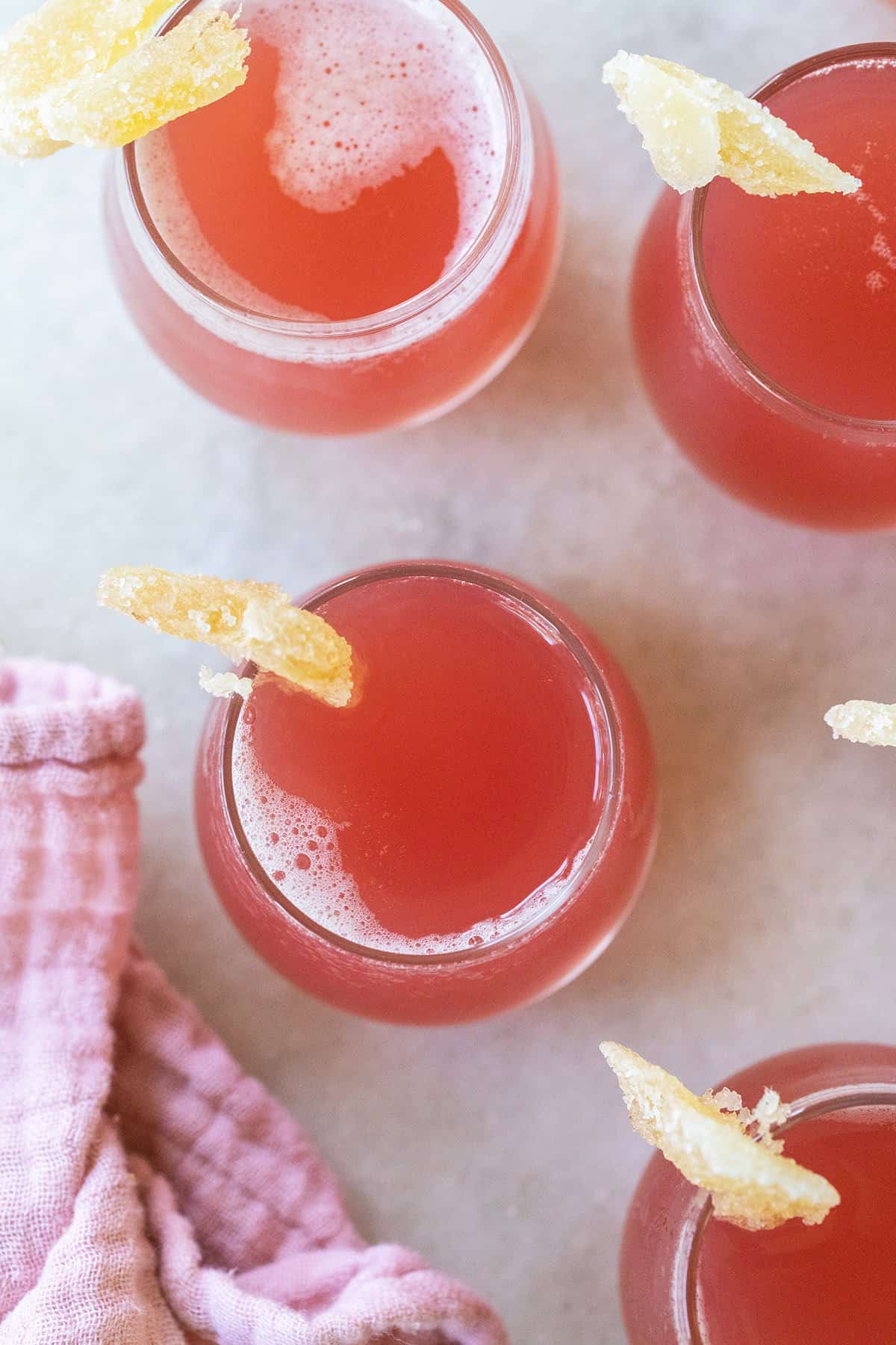 Pink Jolly Rancher shots with candied ginger.