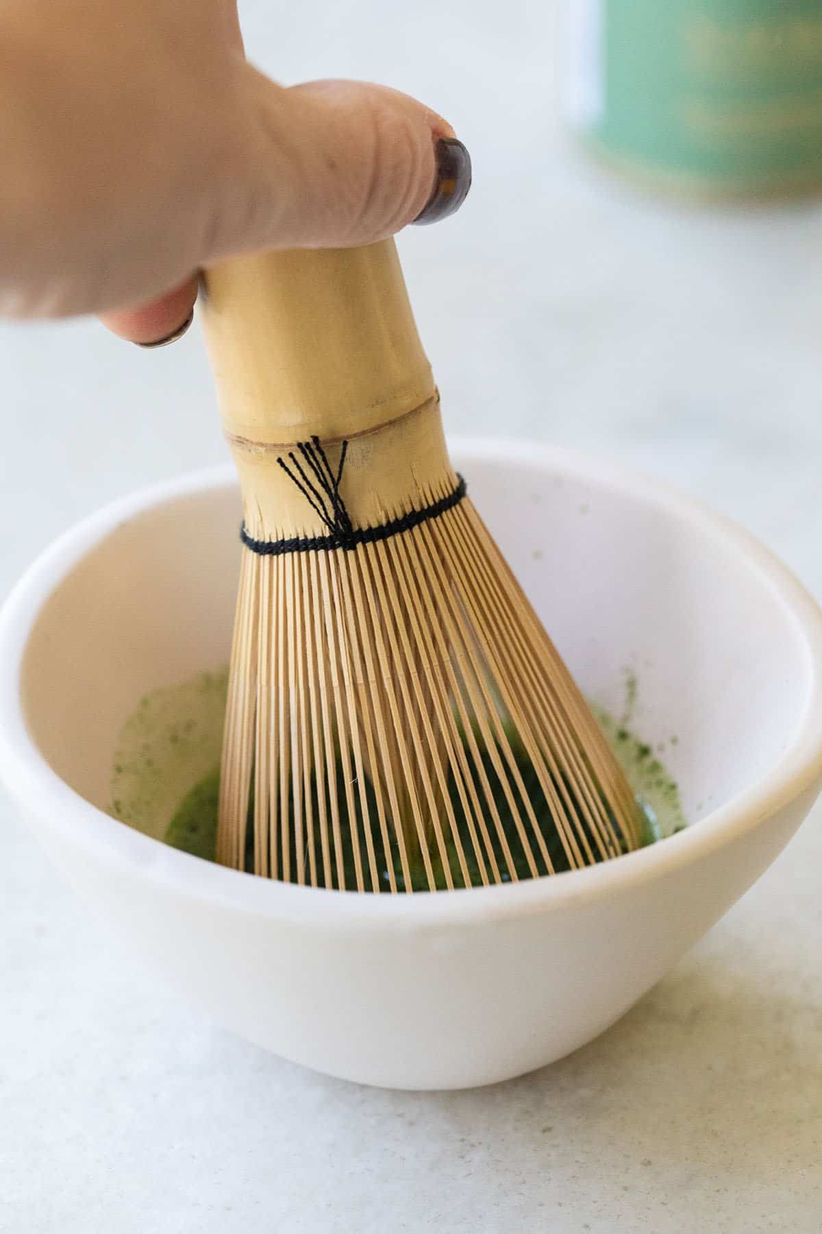 whisking matcha powder