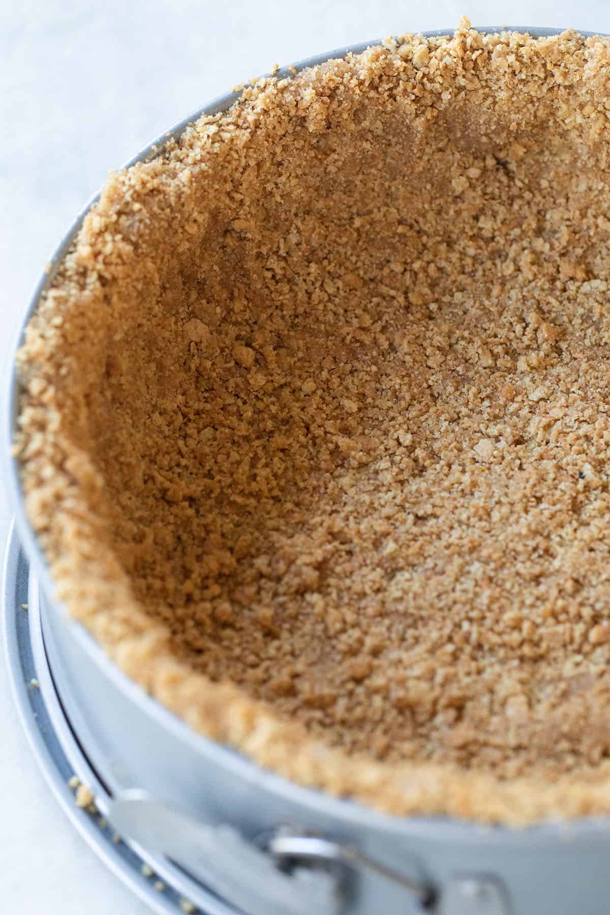 graham cracker crust in a springform pan