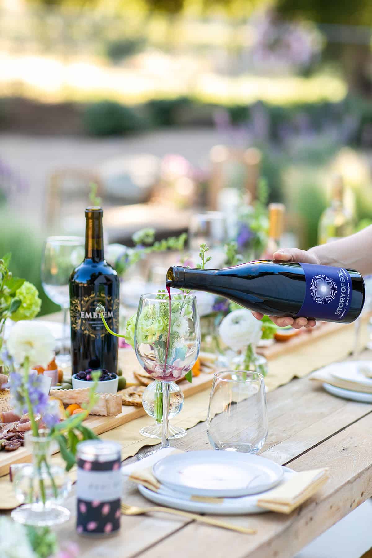 pouring red wine into a wine glass 