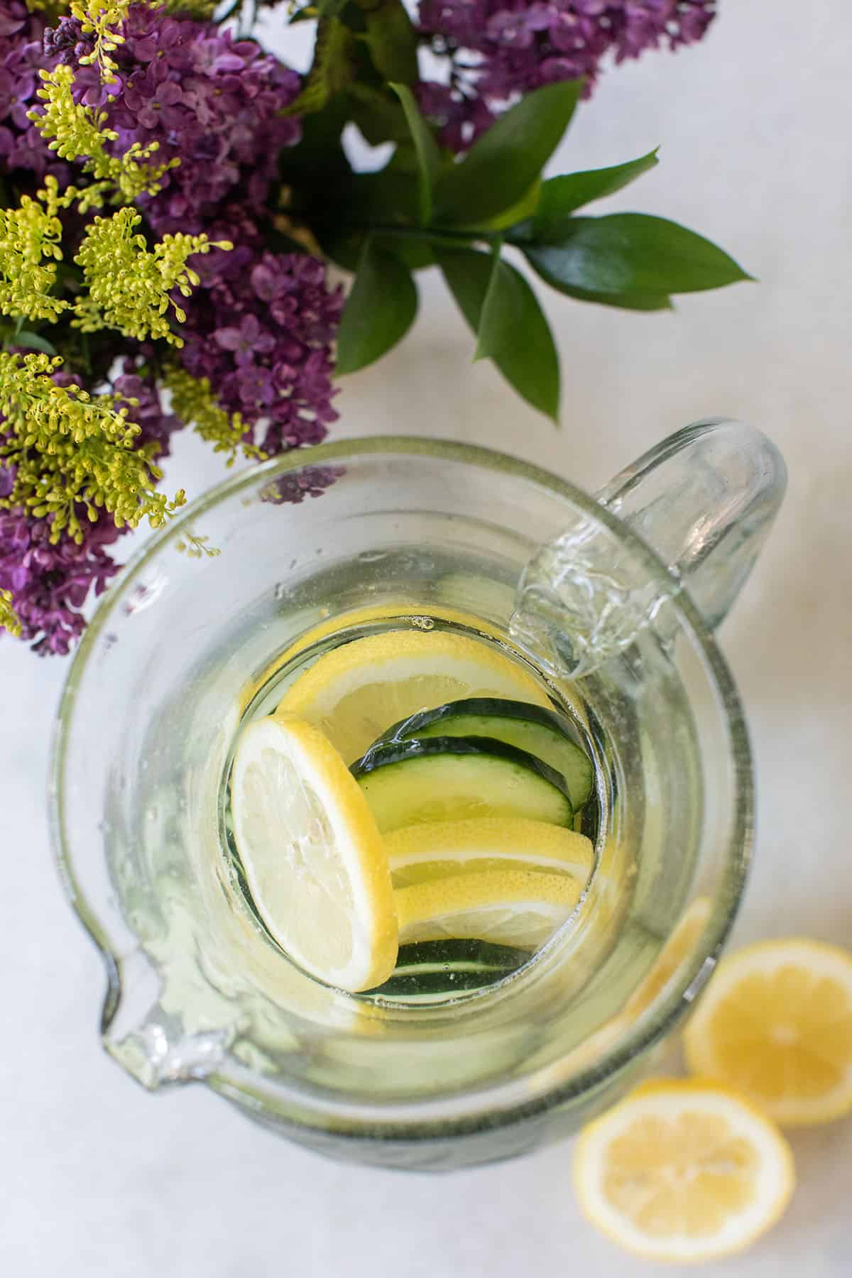 lemon cucumber water in a pitcher 