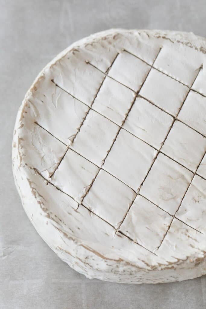 Slices cut into brie cheese.