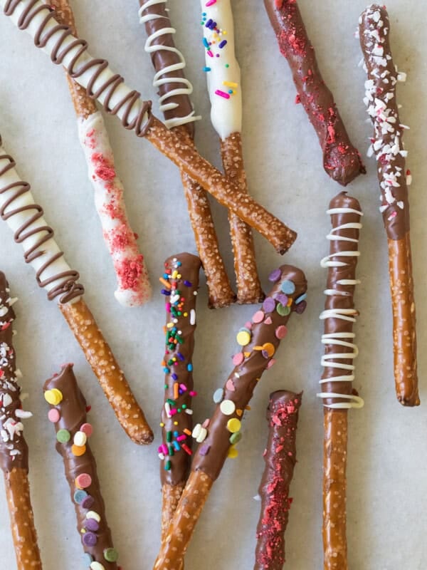 chocolate covered pretzel rods with sprinkles