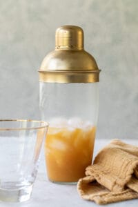 rum, orange juice and vodka in a cocktail shaker