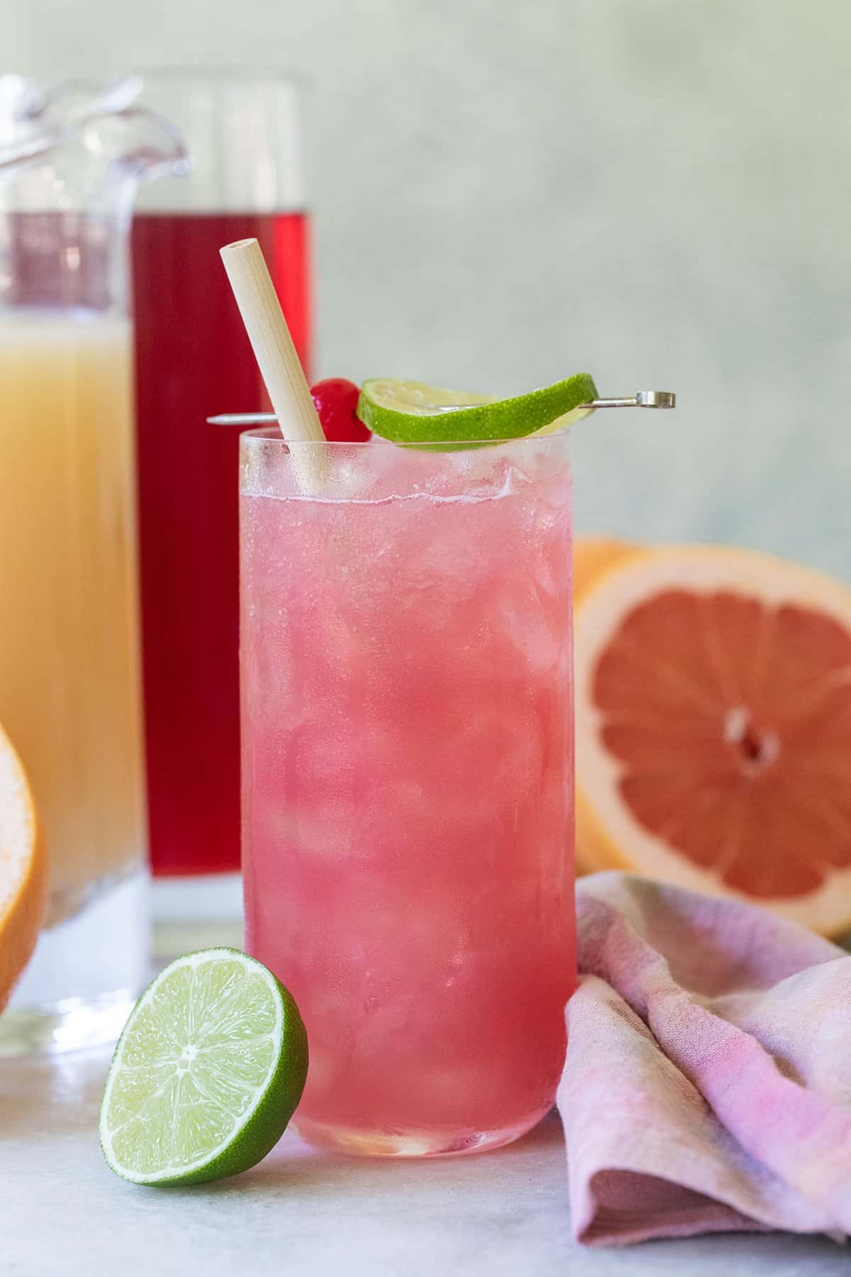 Easy sea breeze cocktail recipe with lime and cherry.