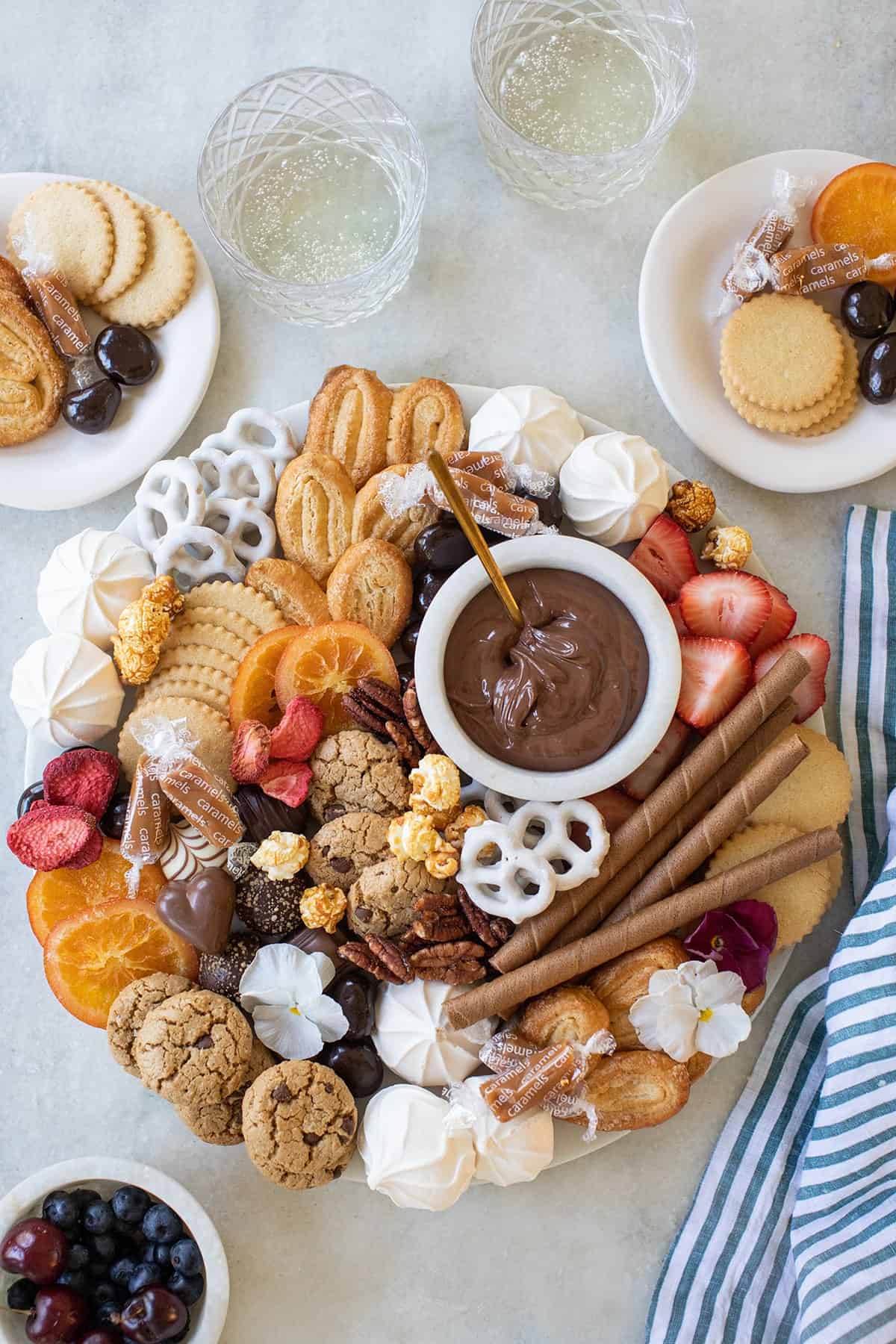 dessert charcuterie board filled with cookies and candy.