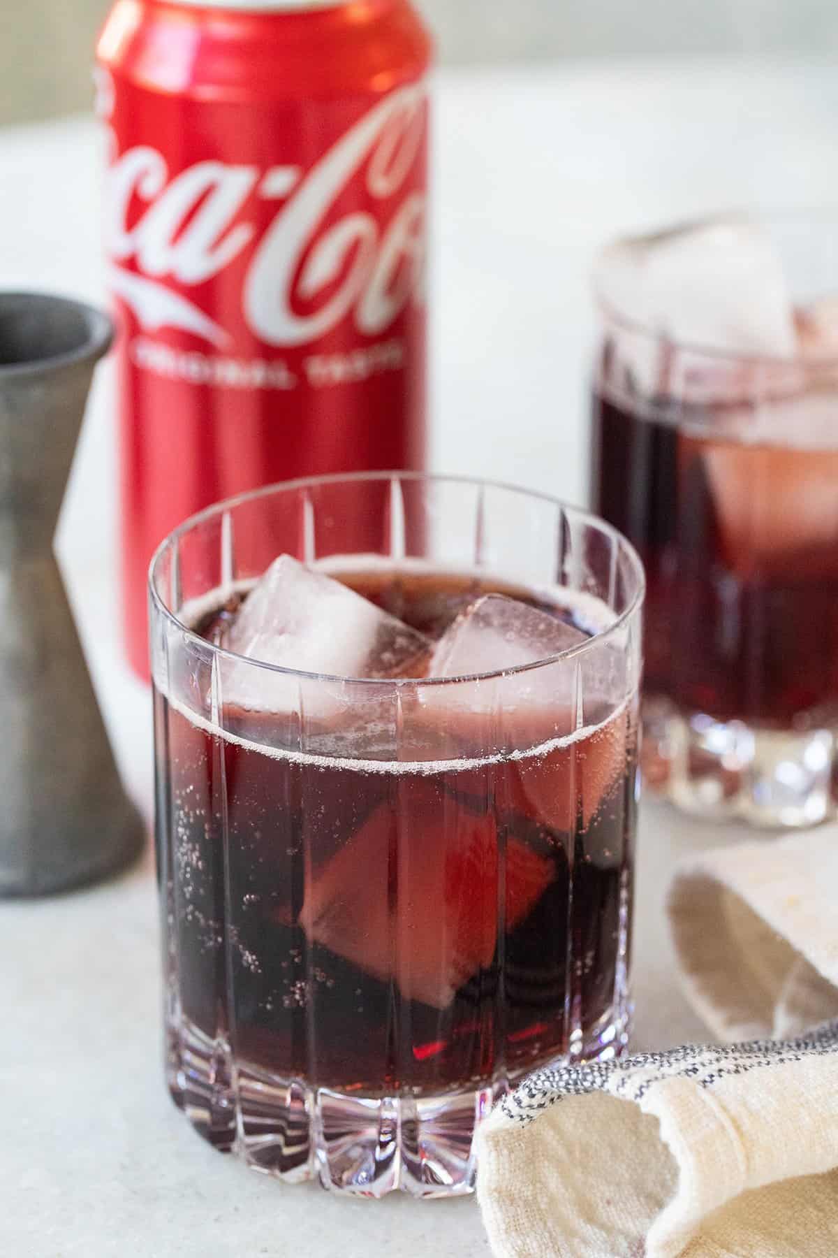 Wine and Coca Cola in a glass with ice. 