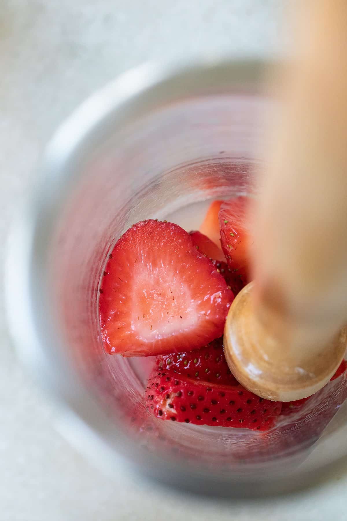 muddling strawberries