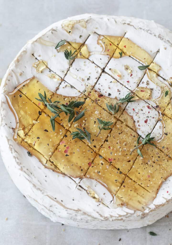 Brie cheese with honey and herbs.