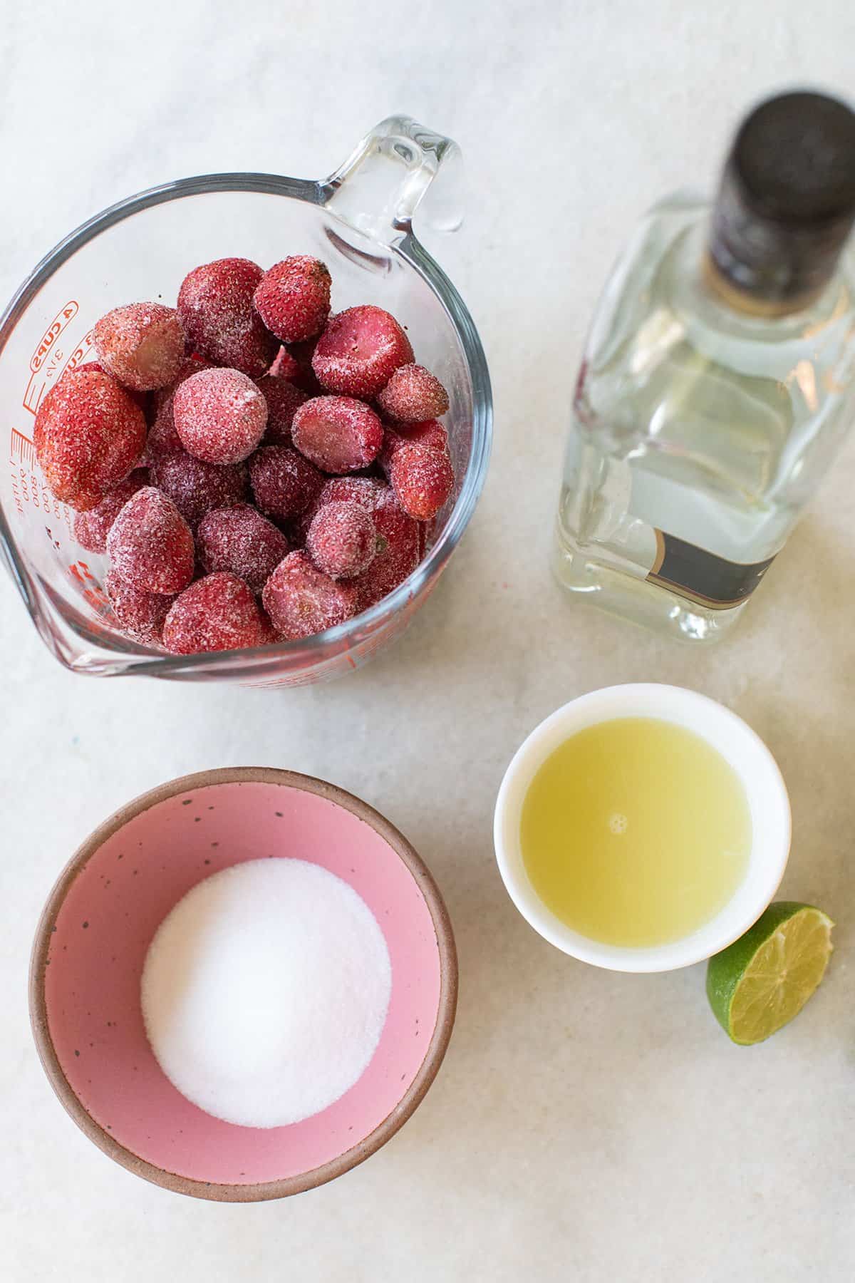 frozen strawberries, rum, lime juice and sugar