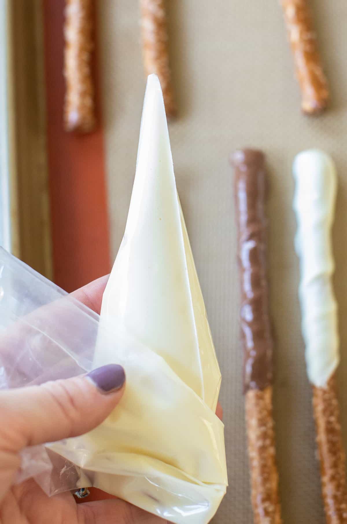 white chocolate in a piping bag to make a drizzle.