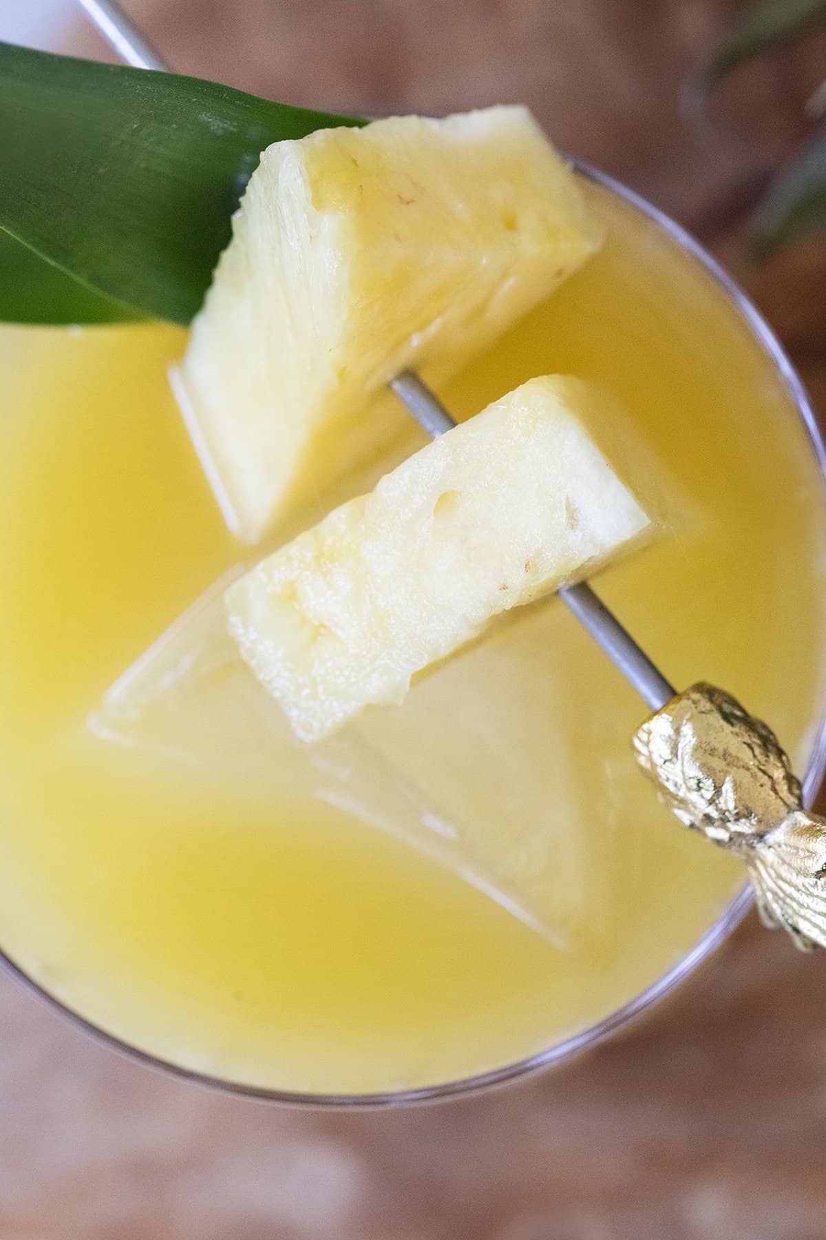 pineapple wedges on a cocktail pick