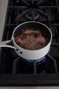 grenadine syrup boiling in a small pot