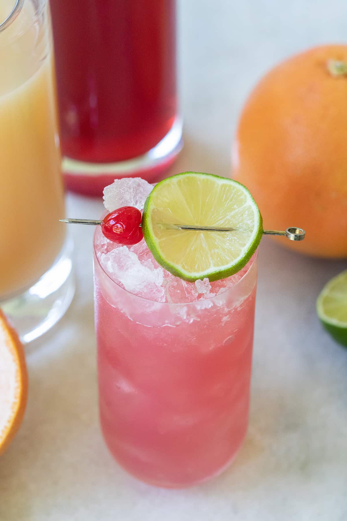 Easy three-ingredient cocktail with a pink color, cranberry juice, vodka, and grapefruit juice.