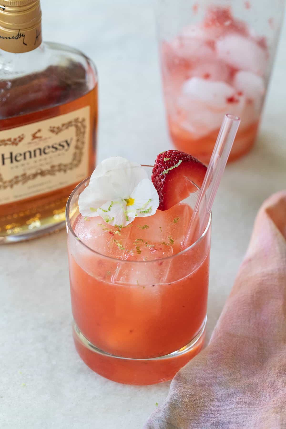 pink cocktail with strawberries and cognac 