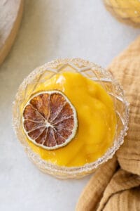 a frozen mango margarita in a glass