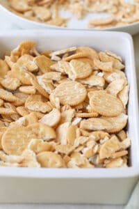 Ritz Crackers in a baking dish crumbled.