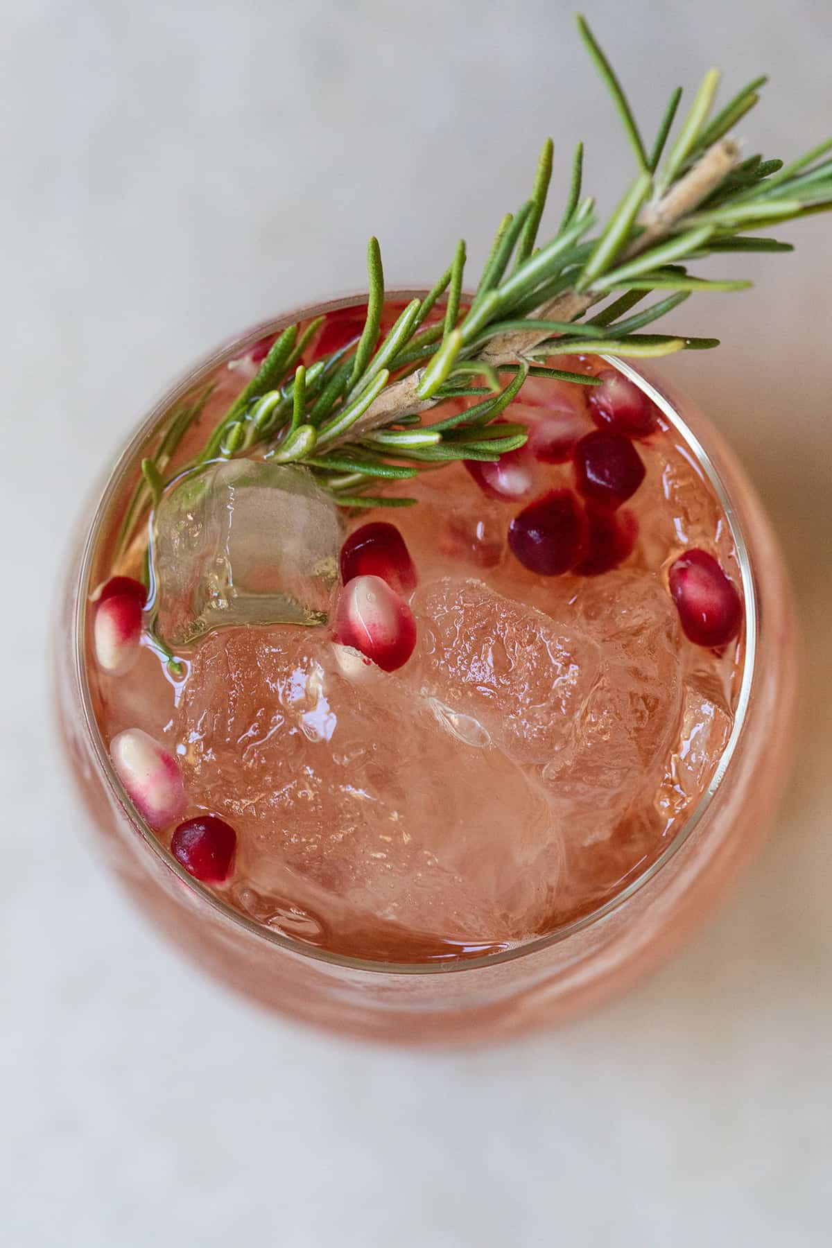 red holiday punch with rosemary and pomegranate
