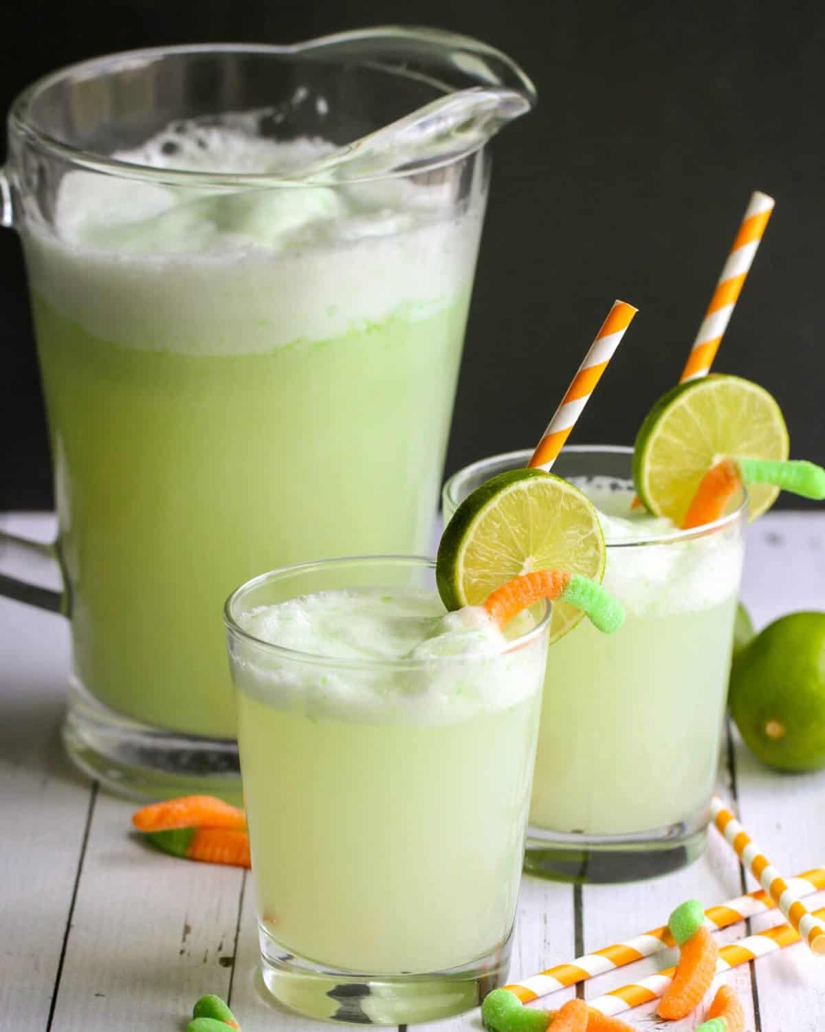 Green drink with lime and gummy warms.