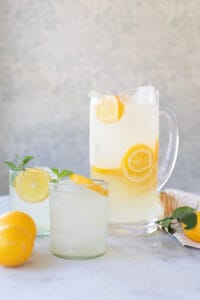 lemonade in a pitcher with sliced lemons