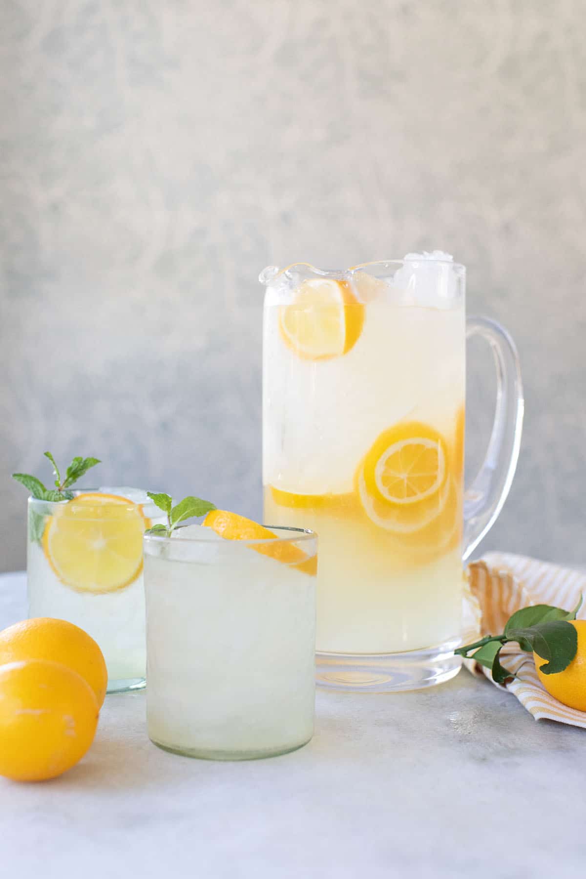 lemonade in a pitcher with sliced lemons