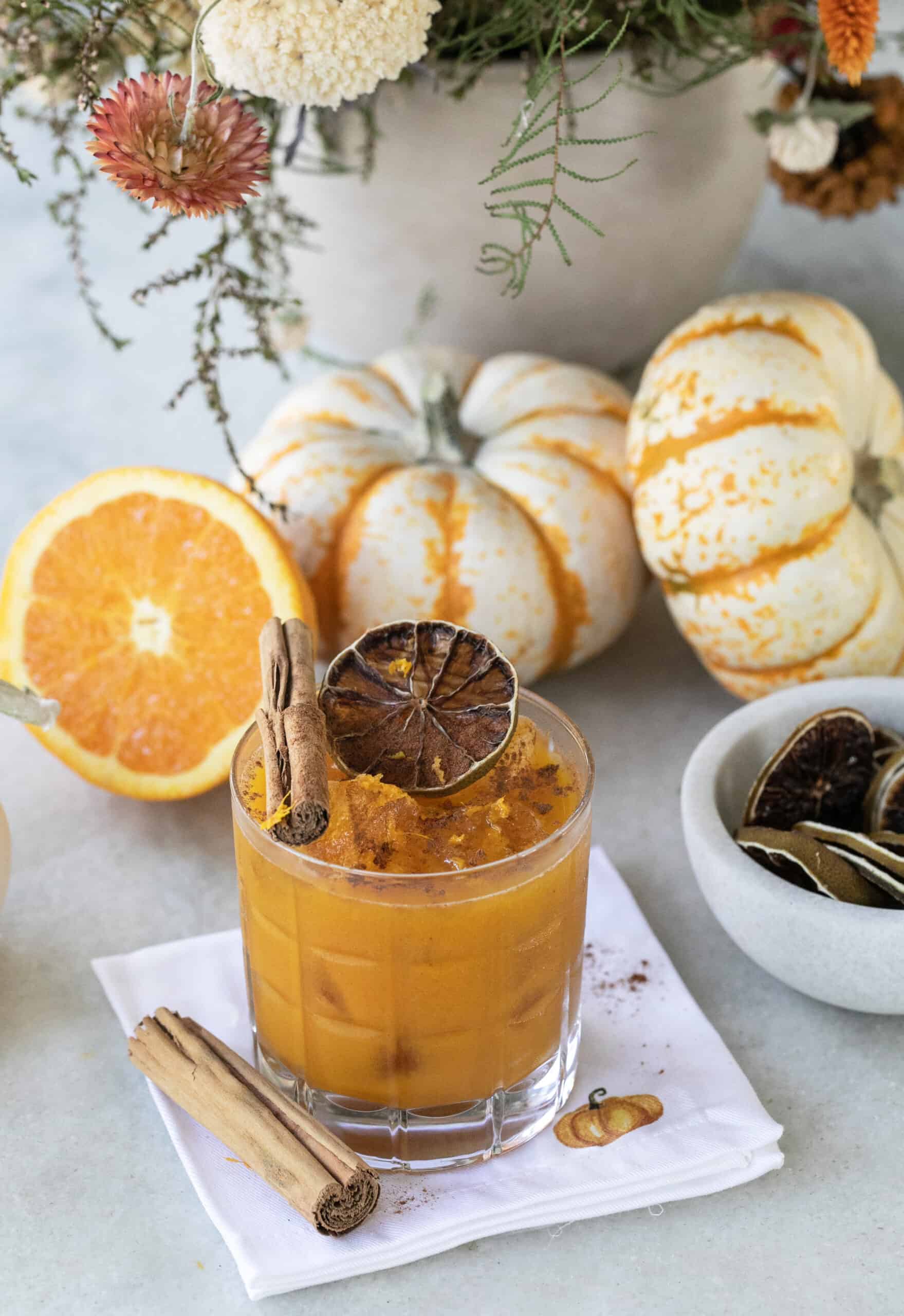 Orange cocktail with pumpkins.